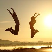 man and woman jumping